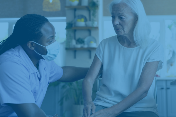 carer and resident sitting down